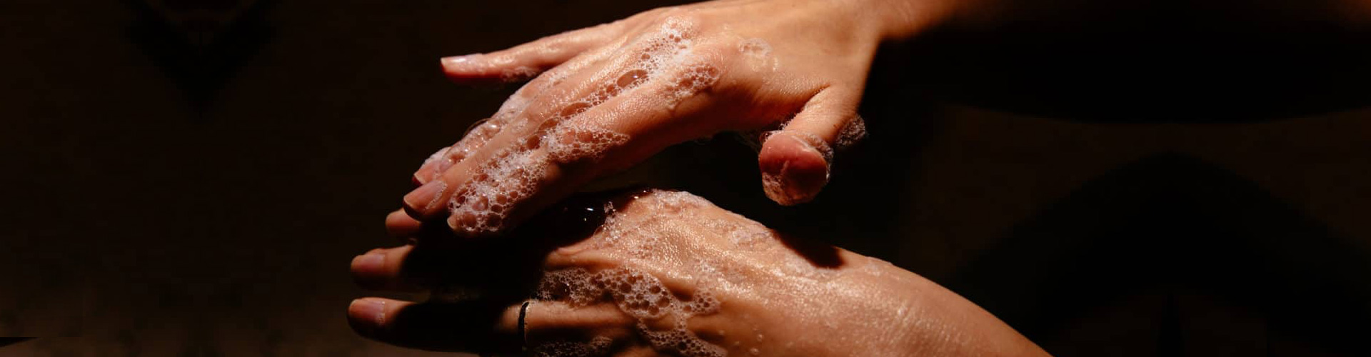 Color photograph of two hands being washed with soap on Ronnie Stangler mD media and events page regarding article by Dr. Stangler in The Ageist, COVID-19: Is "60" the New "70"?