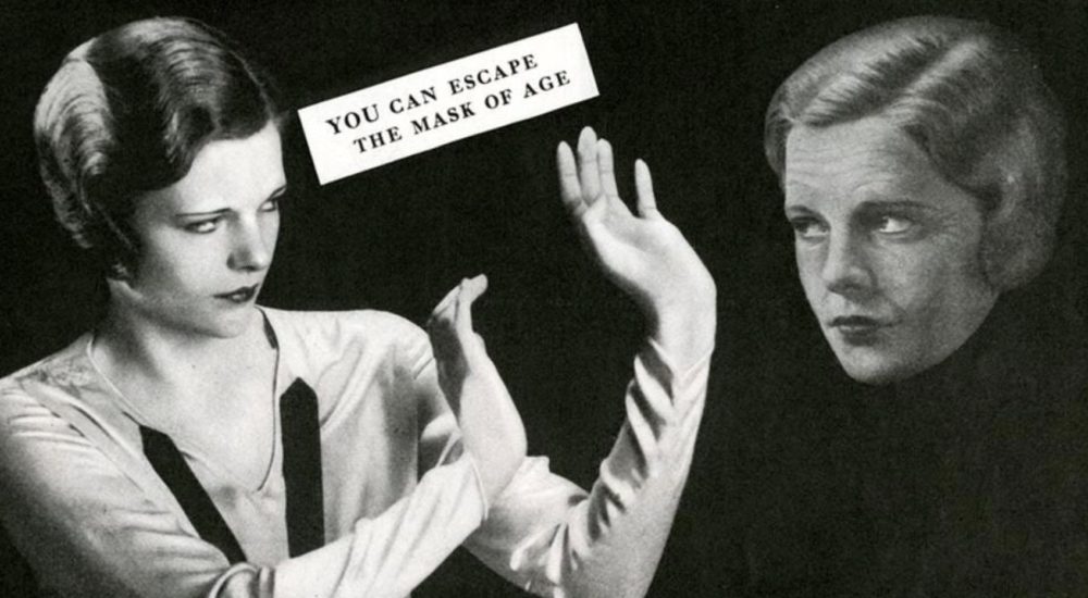 Black and white photograph of two woman with sign You Can Escape the Mask of Age on Ronnie Stangler MD good reads page regarding Reverse Psychological Age and Get Happier with AI.