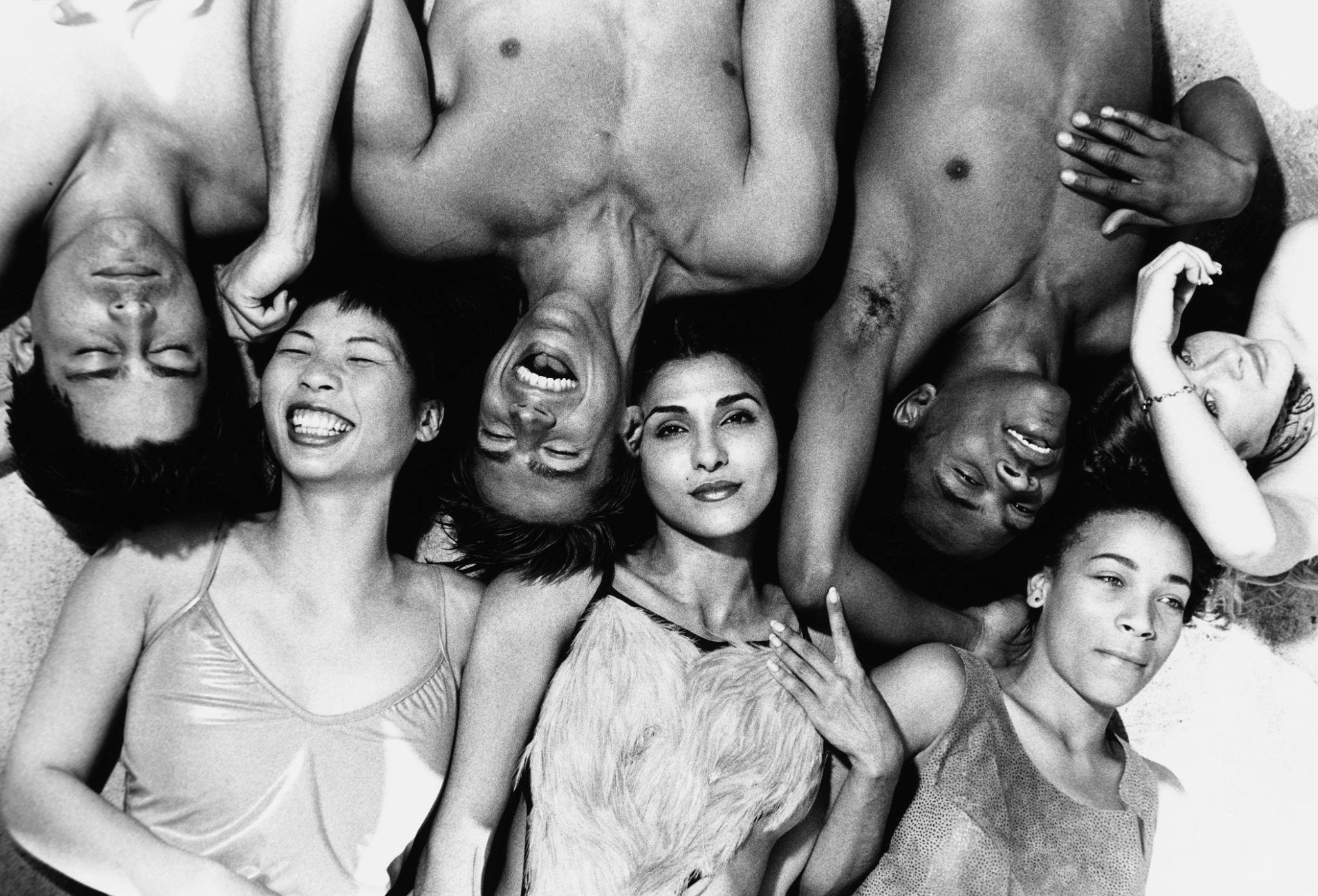 Photograph of diverse group of young adults lying down with heads touching on Ronnie Stangler MD good reads page regarding World’s Longest Development Study Identifies Key to Happiness.