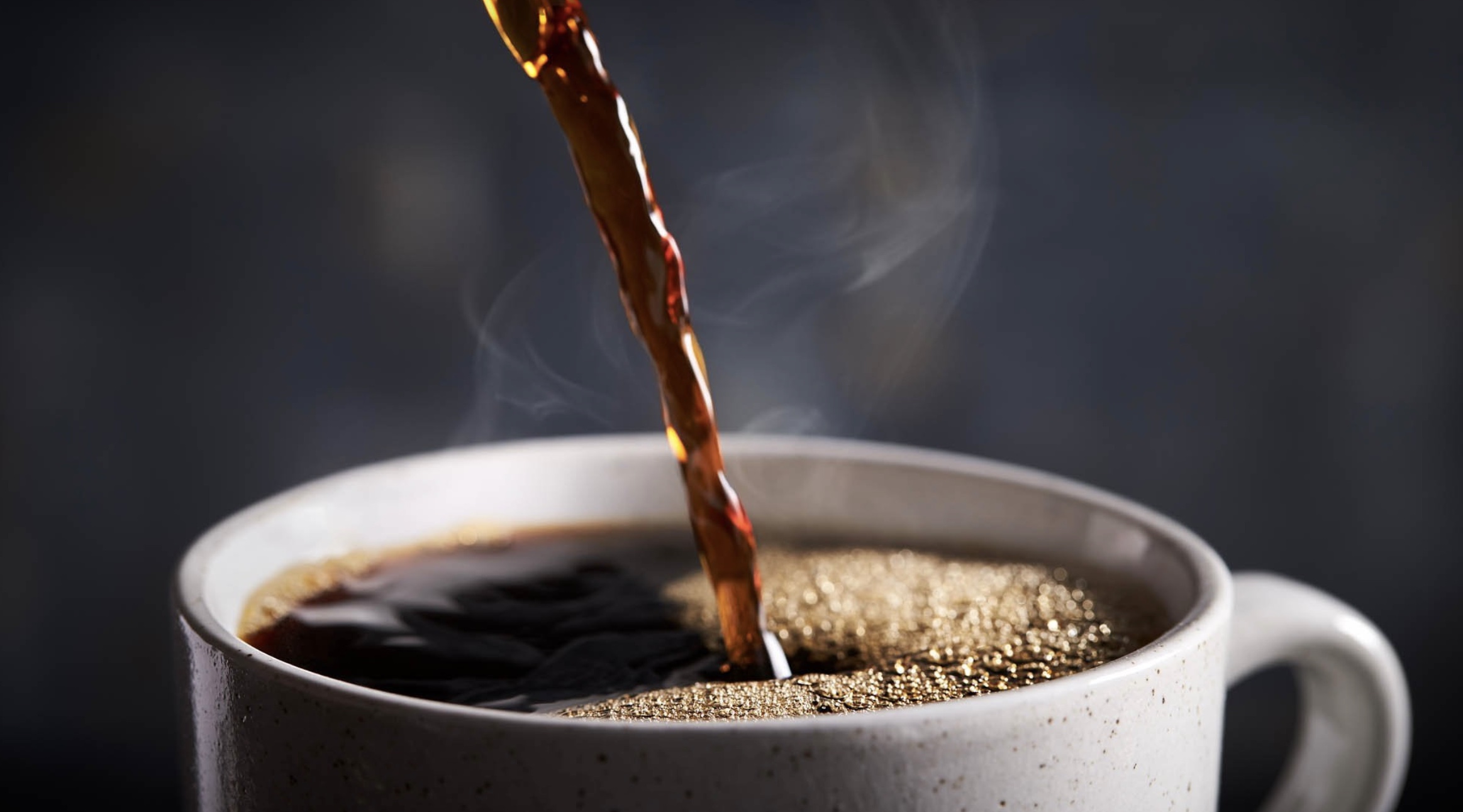 Color photograph of hot coffee being poured into cup on Ronnie Stangler MD Good Reads page regarding Coffee and Healthy Longevity.